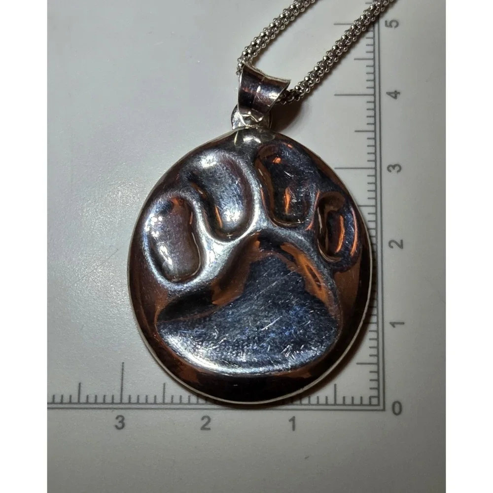 Vintage Sterling Silver Embossed Paw Print Pendant 17